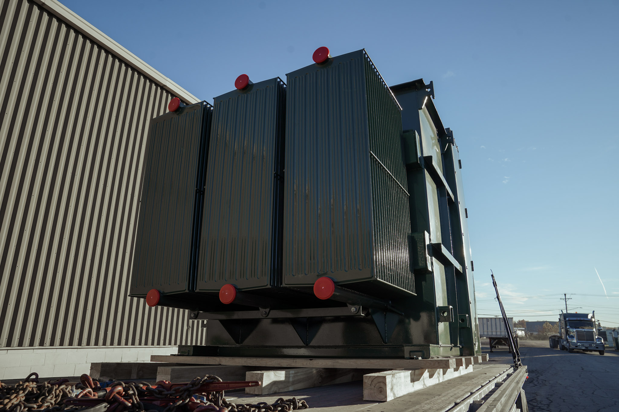 Padmount transformers staged on pallets ready to ship