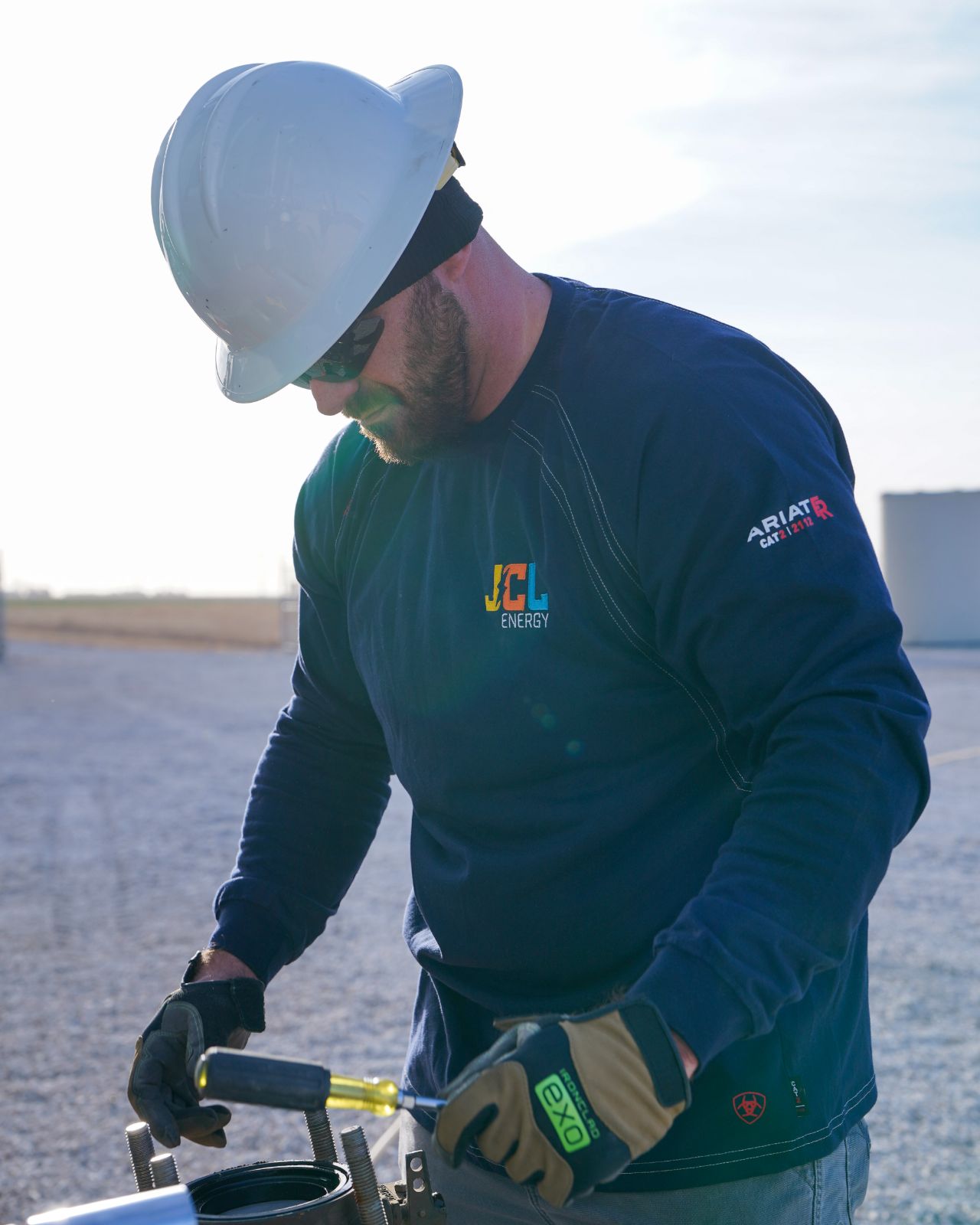 A JCL field service technician working on a transformer