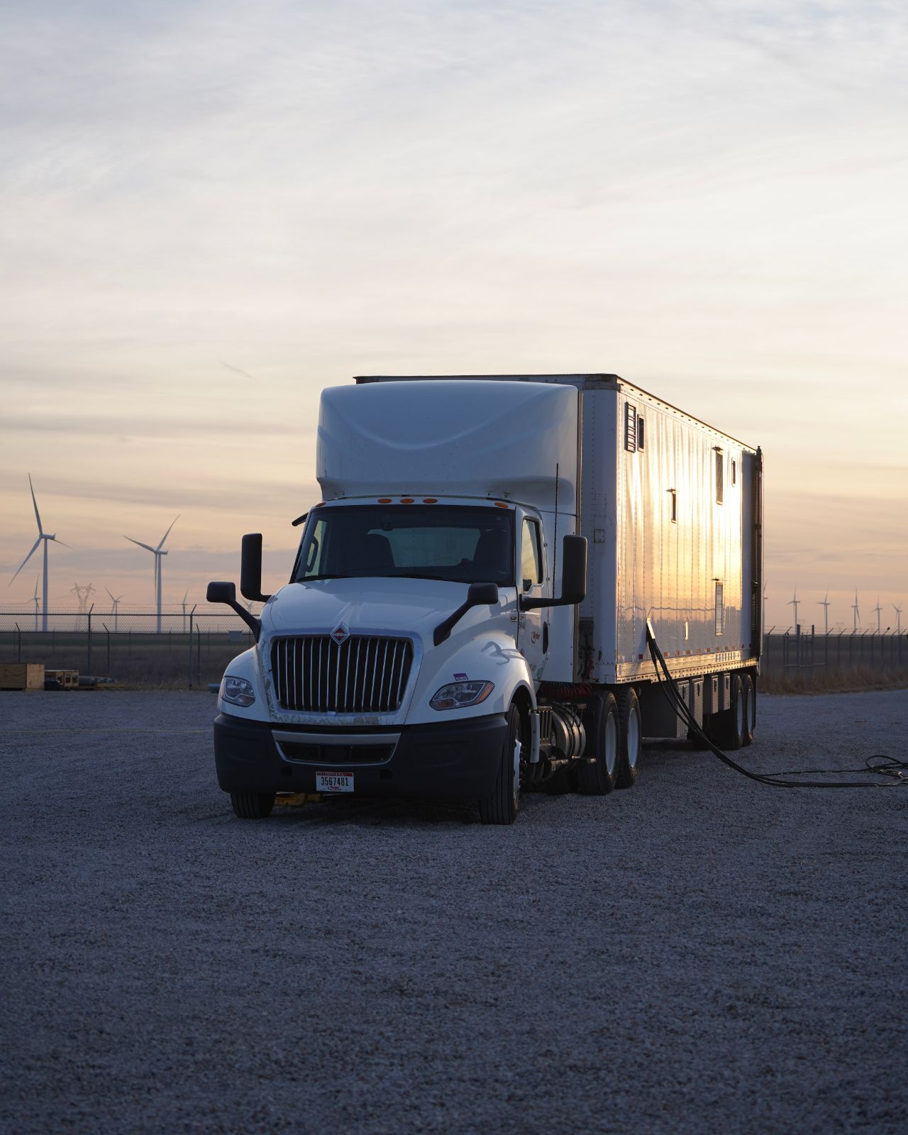 A JCL mobile test trailer on site at dawn