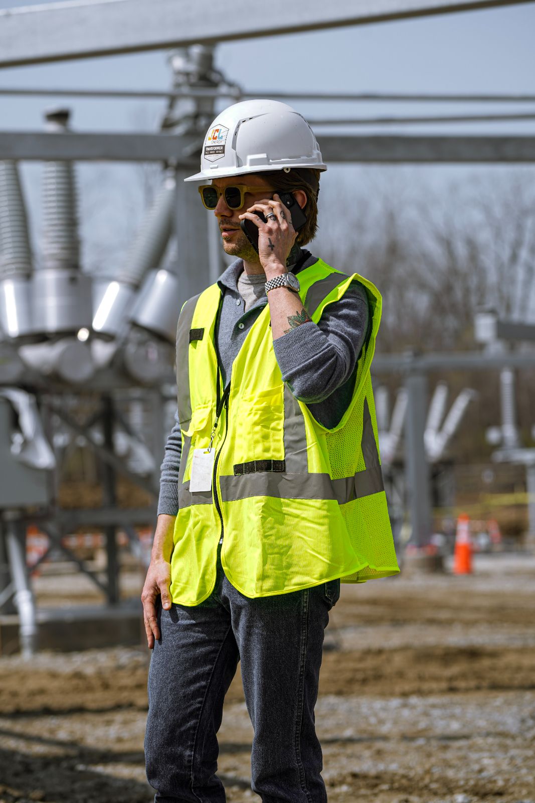A JCL field tech on a call at a substation