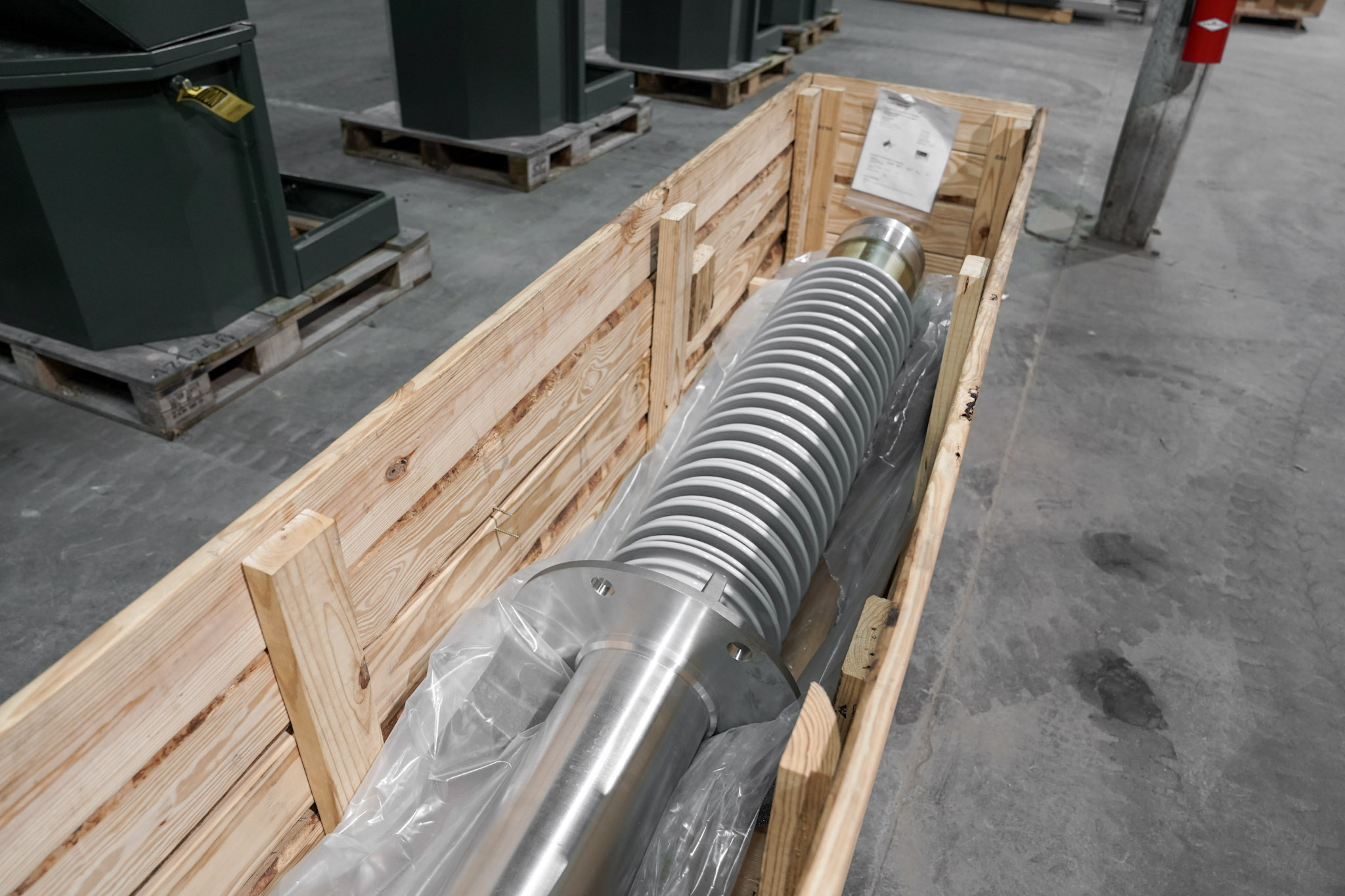 Crated high-voltage bushing ready to ship from the JCL warehouse