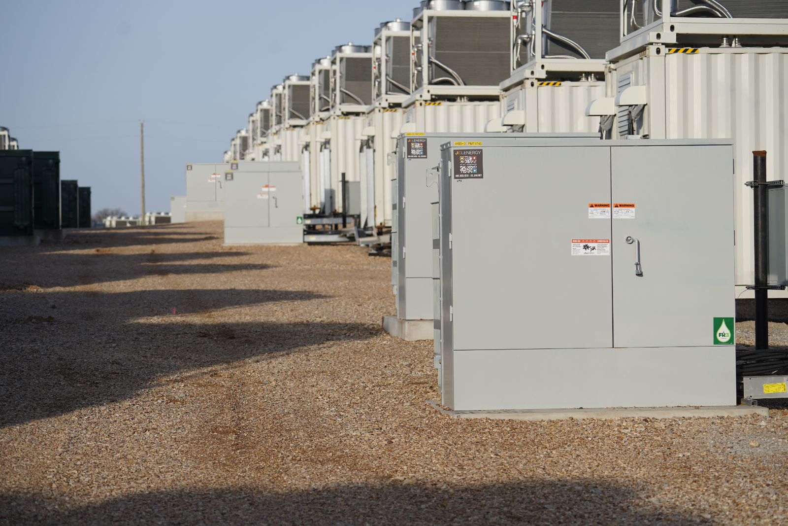 JCL padmount transformers in rows at a battery storage site