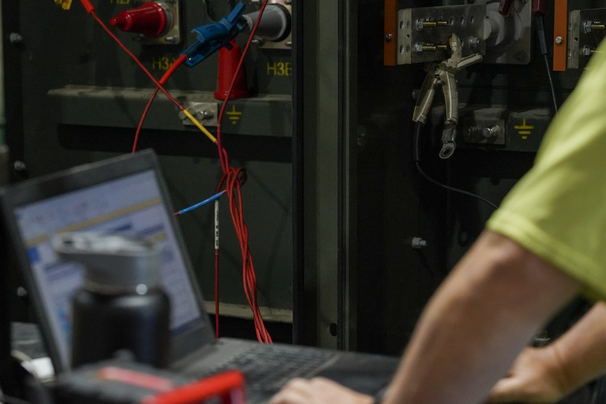 Test leads and a laptop during acceptance testing